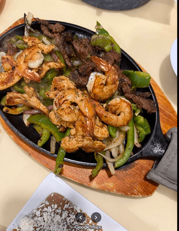 Table spread with food and drinks at La Campana